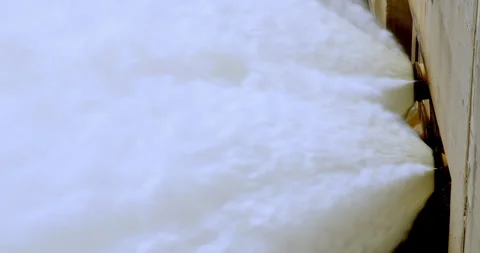 Water being released from outlet at high velocity in slow motion (close up) Stock Footage 294301788