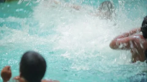 Water being splashed in a pool by kids Stock Footage 54590119