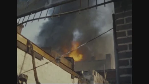 Water being sprayed on burning building - 1968 - 1968 Vídeos de archivo 83659228