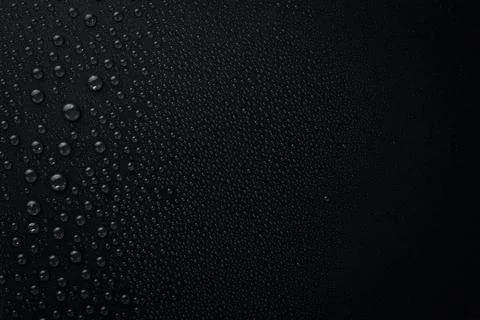 Water. Black background with raindrops. Macro. Top view. Stock Photos