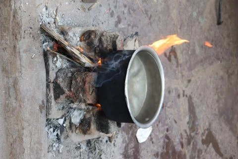 Water boil on the stove firewood in street at kumbharwada , dharvi, mumbai Stock Photos