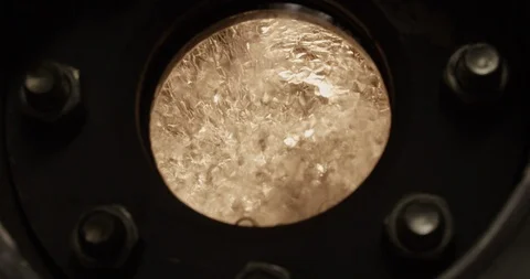 Water boiling and splashing inside a tank with interesting lighting Stock Footage 103541369