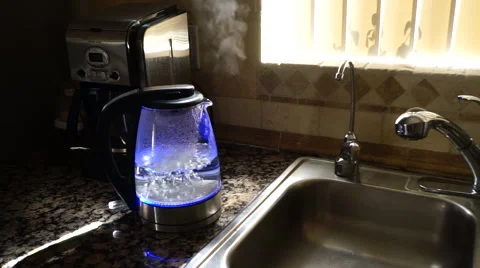 Water boiling in a clear see through LED tea kettle - automatically shuts off Stock Footage 47330855