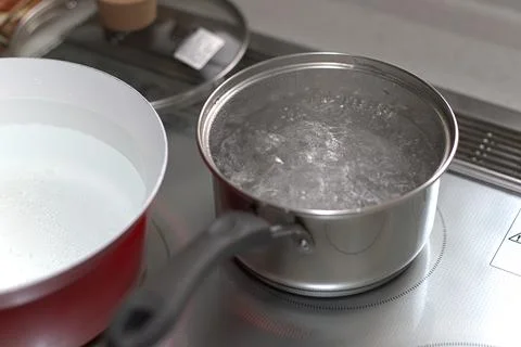 Water boiling on an infared range top Stock Photos