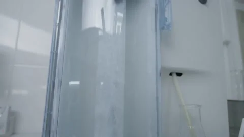 Water Boiling In Machine At Laboratory. Science Technology Close Up Stock Footage 173175602