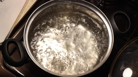 Water boiling in a pan, closeup Stock Footage 133250953