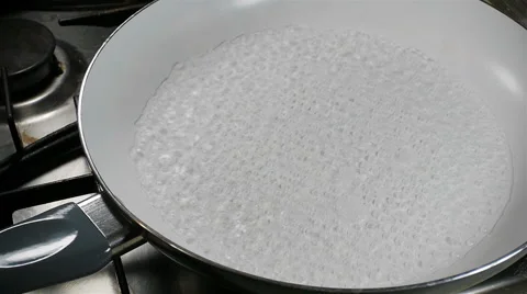 Water boiling in a pan. Slow motion. Stock Footage 57557363