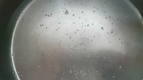Water boiling in the pot - closeup Video stock 109403944