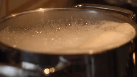 Water in the boiling pot slow motion Stock Footage 96239027