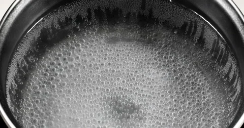 The water is boiling in a saucepan Stock Footage 141342194