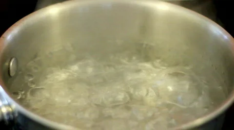 Water boiling in small pot Stock Footage 854866