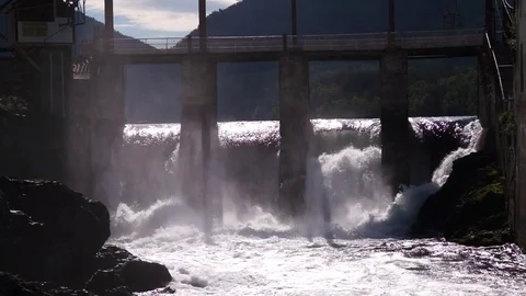 Water boiling in spillway under old hydropower plant Stock Footage 76640559