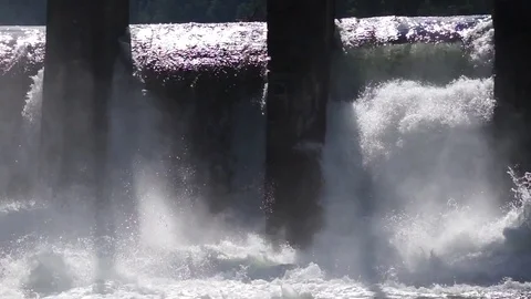 Water boiling in spillway under old hydropower plant Stock Footage 76640653