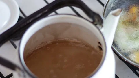 Water boiling with steam Stock Footage