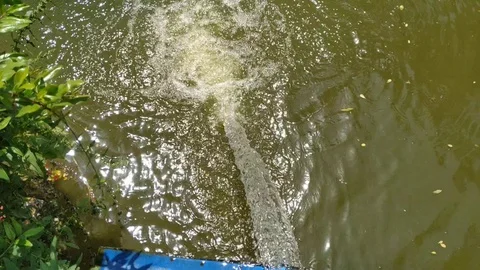 The water is boiling with water while falling in the pond. Stock Footage 128830138