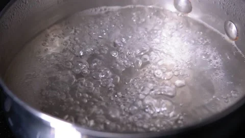 Water boiling,Close-up in pot of boiling water,Bubbles of boiling water. slow Stock Footage 142793581