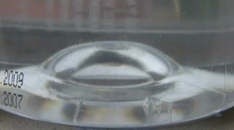 Water Bottle Acts As Lens Stock Footage