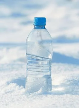 Water bottle in snow Stock Photos