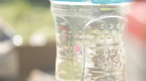 Water in bottle sparkles in sunlight Stock Footage 40208615