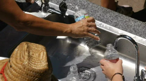 Water Bottles Fill Up Hot Summer - 2 Shots Stock Footage
