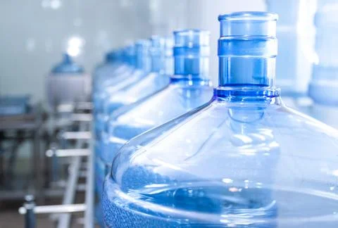 Water bottling line for processing and bottling pure spring water into small Stock Photos