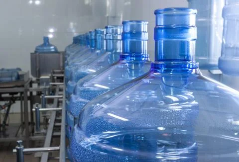 Water bottling line for processing and bottling pure spring water into small Stock Photos