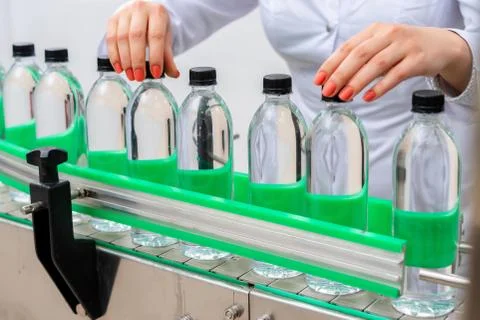 Water bottling line for processing and bottling pure spring water Stock Photos