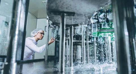 Water bottling line for processing and bottling pure spring water Stock Photos