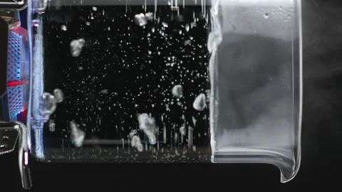 Water breaks down into its constituents, Hydrogen, Oxygen and Carbon Dioxide. Stock Footage 144427641