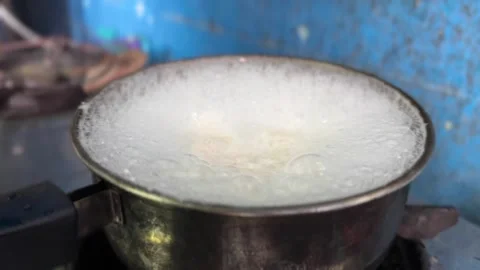 Water bubble boiling in silver pot cooking at home kitchen. Stock Footage 311969637