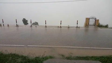 Water bubbles appearing in the road while raining outside Stock Footage 103650009
