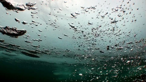 Water bubbles on background underwater landscape under ice of Baikal. 動画素材 100379538