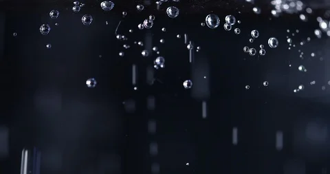Water bubbles on black background, microscope look Stock Footage 104675339