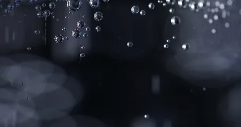 Water bubbles on black background, microscope look Stock Footage 104676990