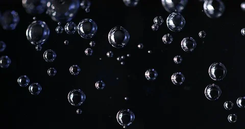 Water bubbles on black background, microscope look Stock Footage 104677335
