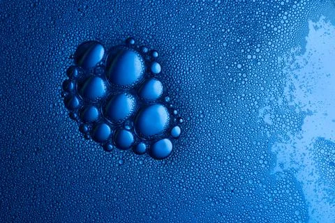 Water bubbles creating abstract blue liquid pattern texture Stock Photos