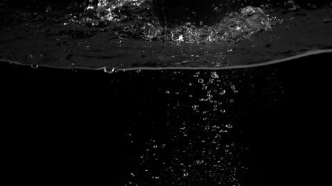 Water bubbles floating on black background Stock Photos