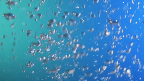 Water bubbles in front of blue and green background Stock Footage 106076307