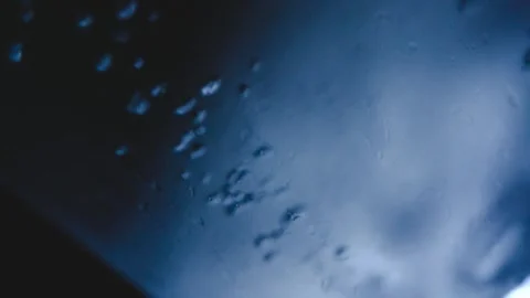 Water bubbles on glass, close up of liquid ice in glass motion and macro Vidéo 162448278