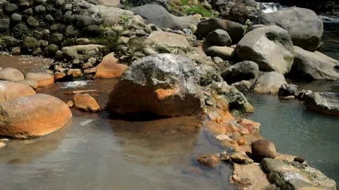 Water bubbles from a hot spring containing sulfur Stock-Footage 292672627