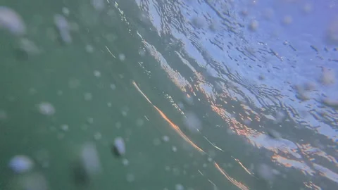 Water bubbles moving underwater in green liquid, abstract background with Stock Footage 343074465