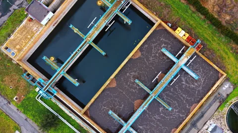 Water bubbles in one of the rectangular reservoirs with sewage inside. Recycling 스톡 동영상 332370895