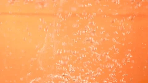 Water bubbles on orange background Stock Footage 254727584