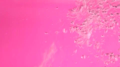 Water bubbles on pink background Stock Footage 226583846