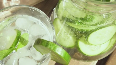 Water with bubbles is poured into a decanter slow motion Stock Footage 89087455