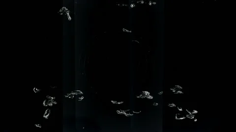 Water bubbles rising on black background, Slow Motion Stock Footage