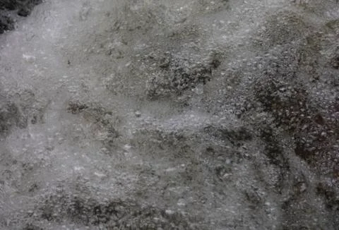 Water bubbles in a running stream Stock Photos