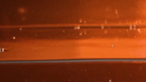 Water bubbles on shiny orange background Stock Footage 254727016