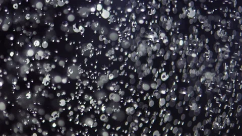 Water bubbles in slow motion in dark water Stock-Footage 234504765