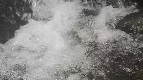 Water bubbles from the waterfall Stock Footage 205523972